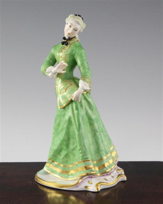 A Nymphenburg porcelain figure of Julia, after the Commedia Dellarte figure by Bustelli, 20th century, height 21.5cm (8.5in.)